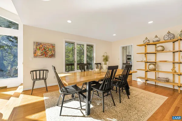a view of a dining room with furniture window and wooden floor