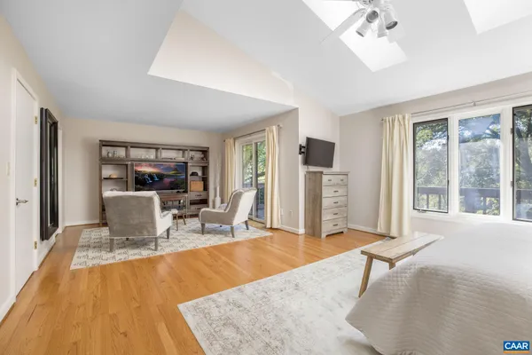 a bedroom with a bed and a table in it
