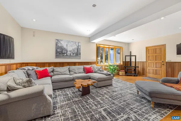 a spacious bedroom with two beds and a couch