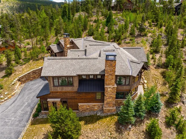 a aerial view of a house with a yard