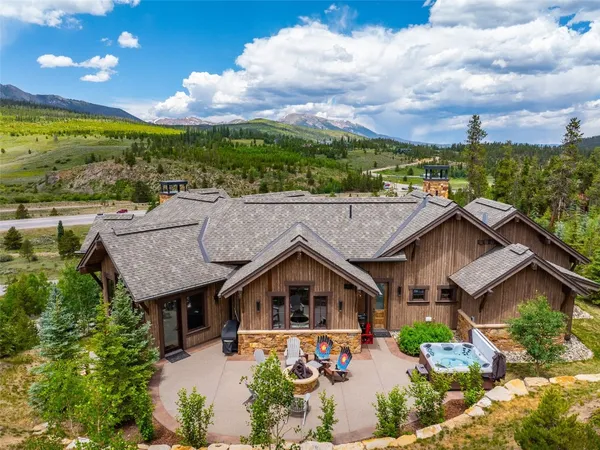 an aerial view of a house with a big yard
