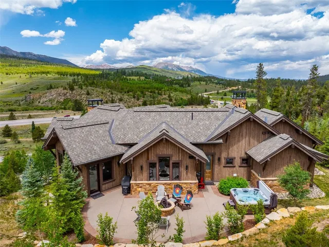 an aerial view of a house with a big yard
