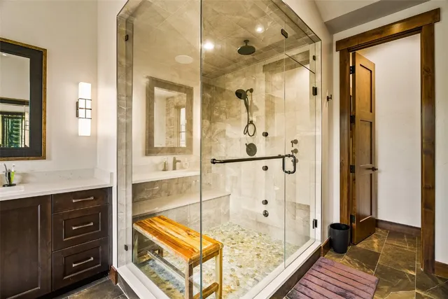 a bathroom with a tub and shower