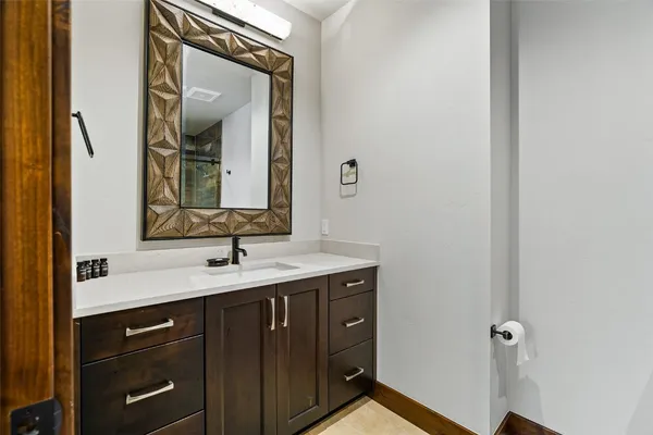 a bathroom with a sink and a mirror