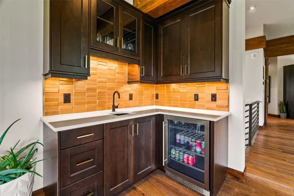 a kitchen with stainless steel appliances granite countertop a sink and cabinets