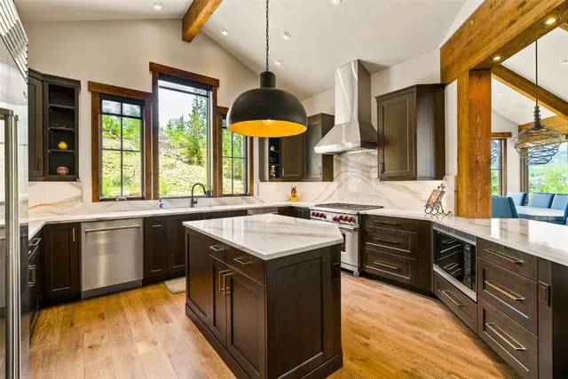 a kitchen with stainless steel appliances granite countertop counter space a sink and a large window