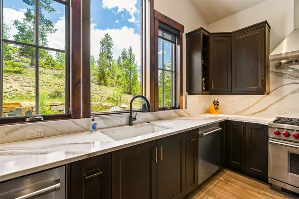 a kitchen with a sink and a window