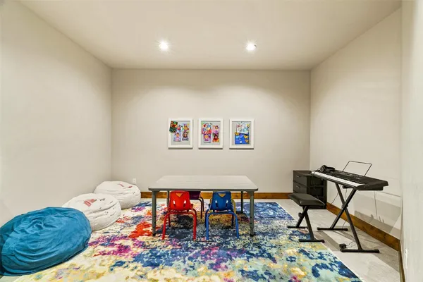 a living room with furniture and a rug
