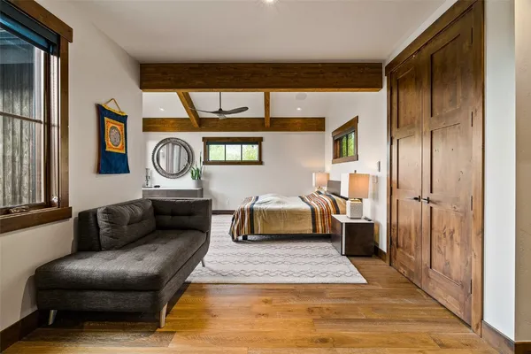 a living room with a couch and a clock
