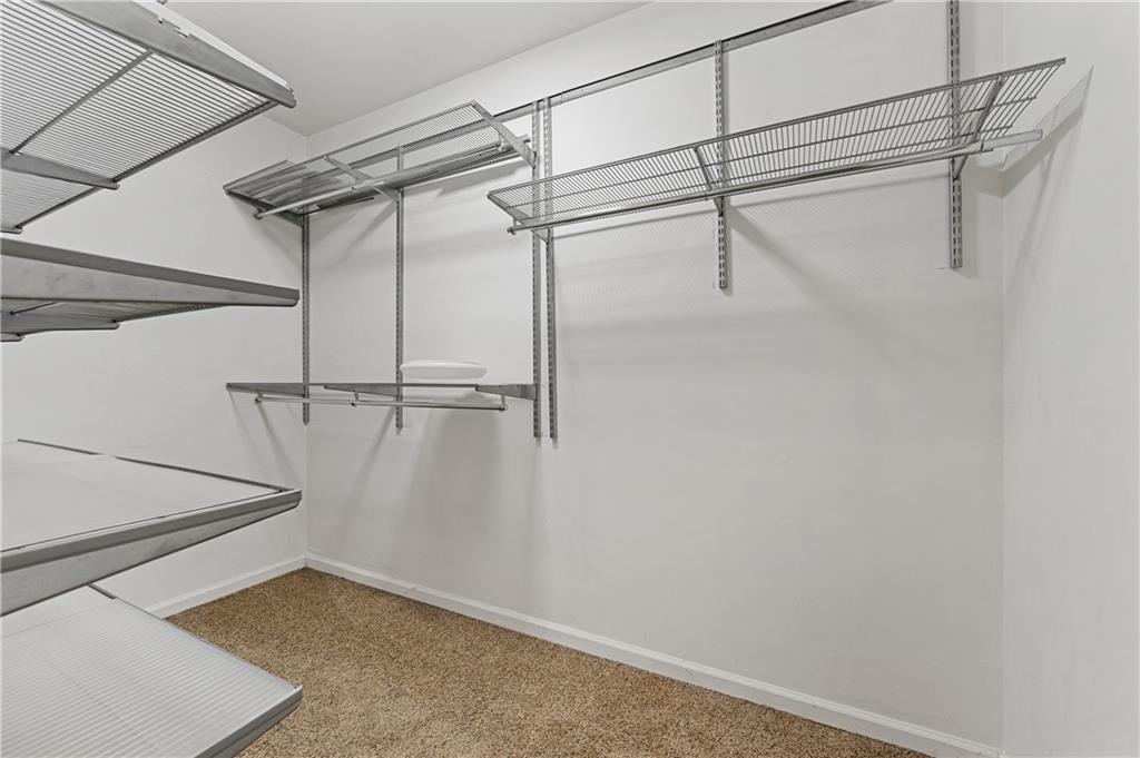 220 Renaissance Parkway Northeast, Unit 2119 Atlanta, GA 30308 - Photo 17 of 19 a view of a room with racks on the wall