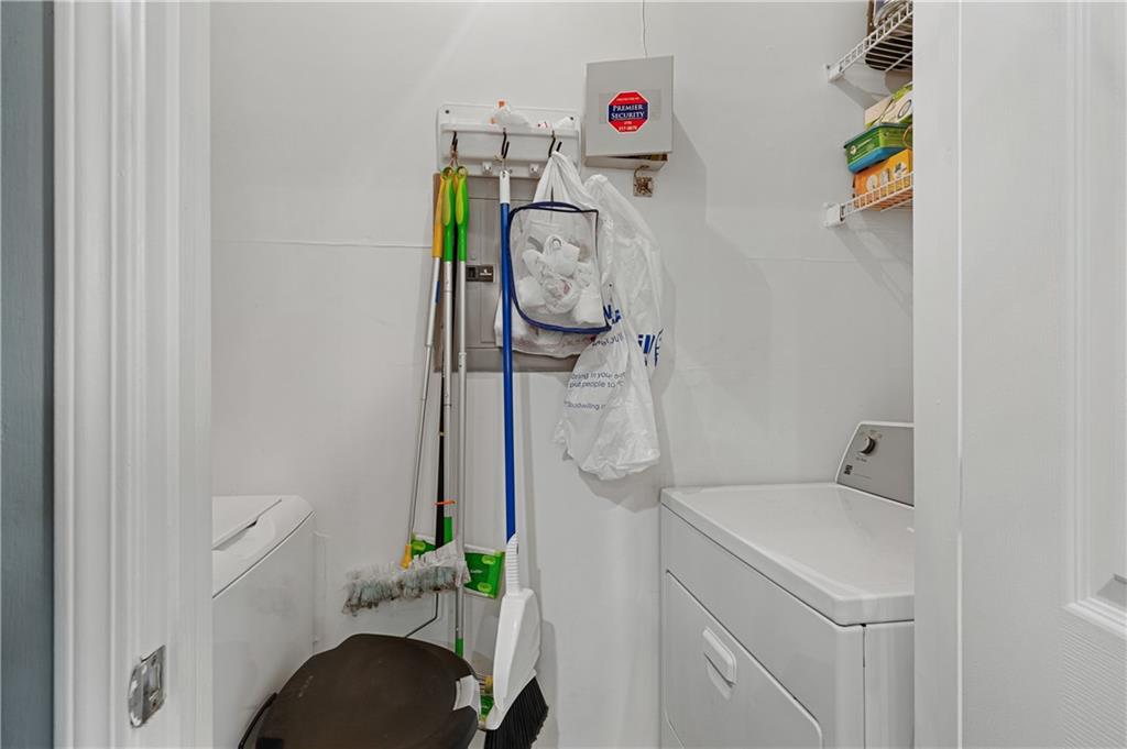 220 Renaissance Parkway Northeast, Unit 2119 Atlanta, GA 30308 - Photo 18 of 19 a bathroom with a sink and toilet