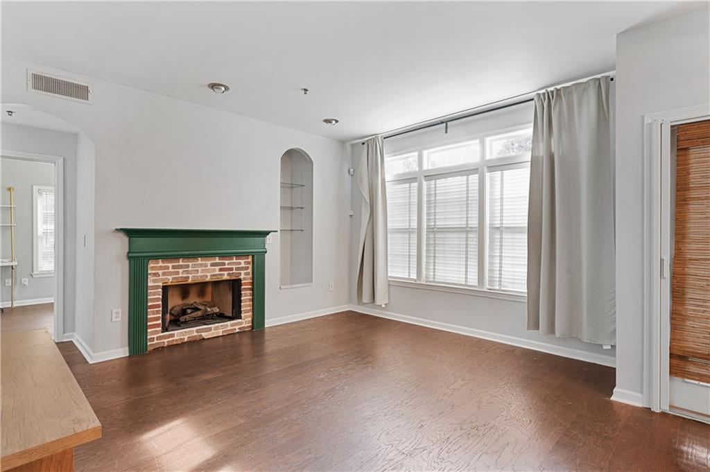 220 Renaissance Parkway Northeast, Unit 2119 Atlanta, GA 30308 - Photo 7 of 19 a view of empty room with a fireplace