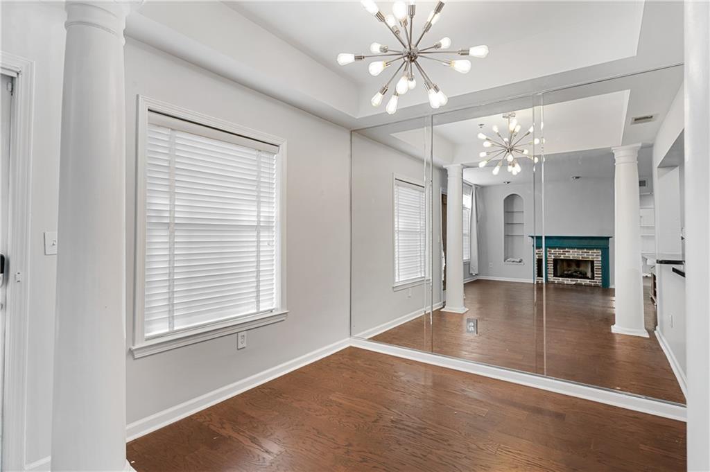 220 Renaissance Parkway Northeast, Unit 2119 Atlanta, GA 30308 - Photo 10 of 19 a view of a livingroom with a ceiling fan and window