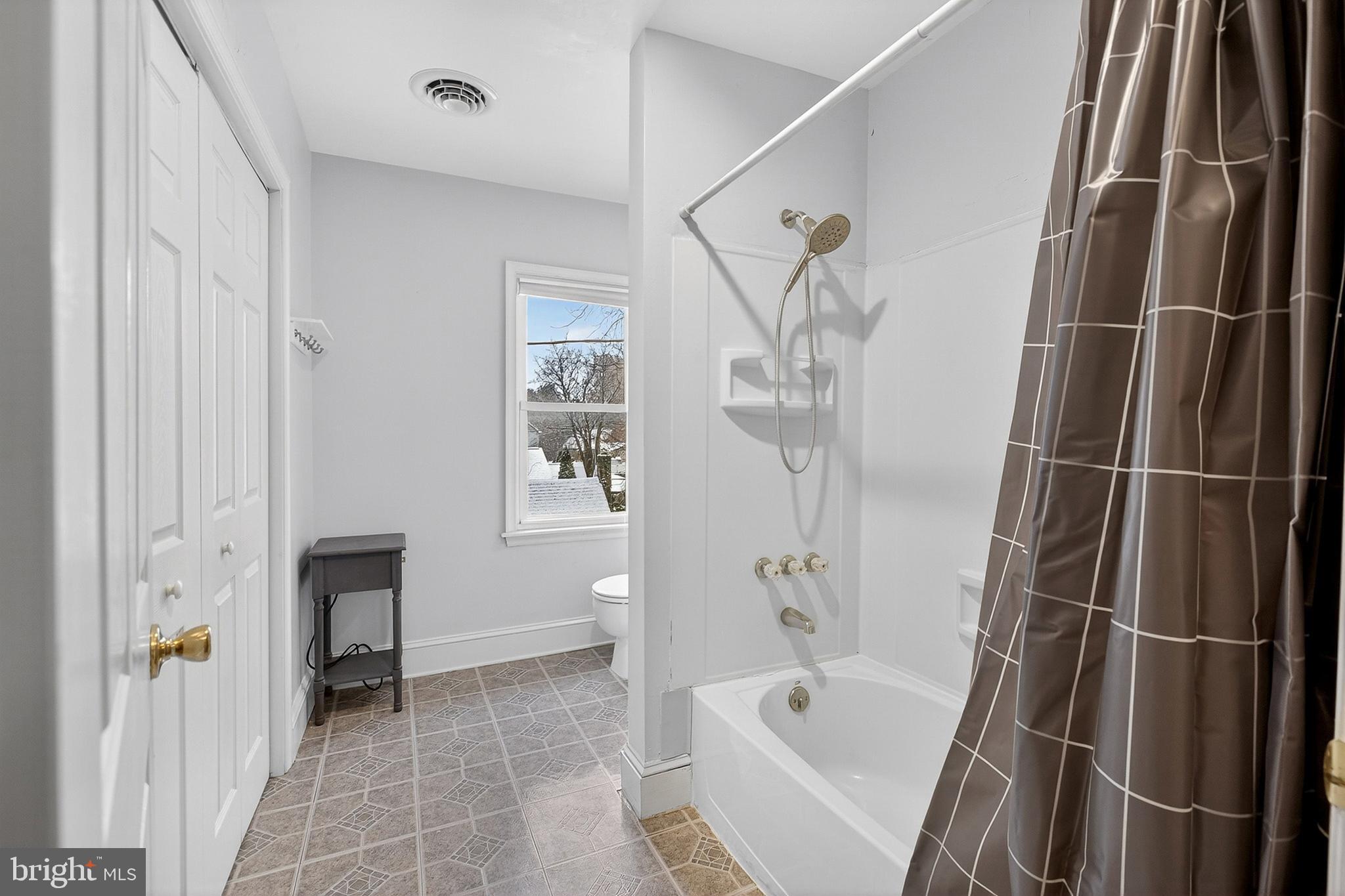 110 West Camden Wyoming Avenue Wyoming, DE 19934 - Photo 16 of 32 a bathroom with a bathtub and a shower