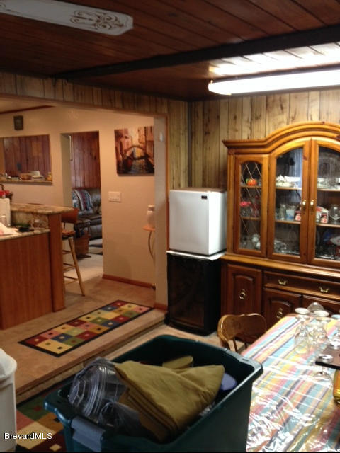 922 Clearlake Road Cocoa, FL 32922 - Photo 2 of 31 a kitchen with a stove and a refrigerator