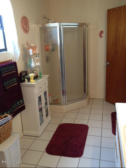 922 Clearlake Road Cocoa, FL 32922 - Photo 14 of 31 a kitchen with a refrigerator and a stove