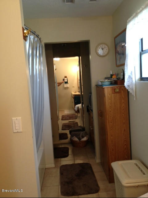 922 Clearlake Road Cocoa, FL 32922 - Photo 18 of 31 a bathroom with a sink a toilet and shower