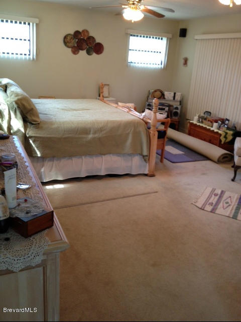 922 Clearlake Road Cocoa, FL 32922 - Photo 19 of 31 a bedroom with a bed and a window