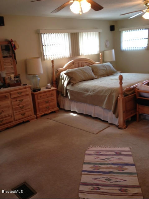 922 Clearlake Road Cocoa, FL 32922 - Photo 20 of 31 a bedroom with a bed and window