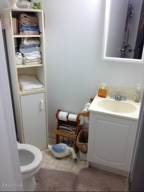 922 Clearlake Road Cocoa, FL 32922 - Photo 24 of 31 a bathroom with a sink and toilet