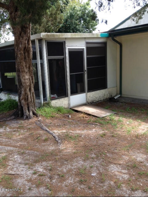 922 Clearlake Road Cocoa, FL 32922 - Photo 7 of 31 a view of a house with a yard