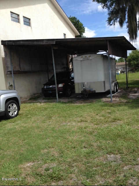 922 Clearlake Road Cocoa, FL 32922 - Photo 10 of 31 a front view of a house with a garden