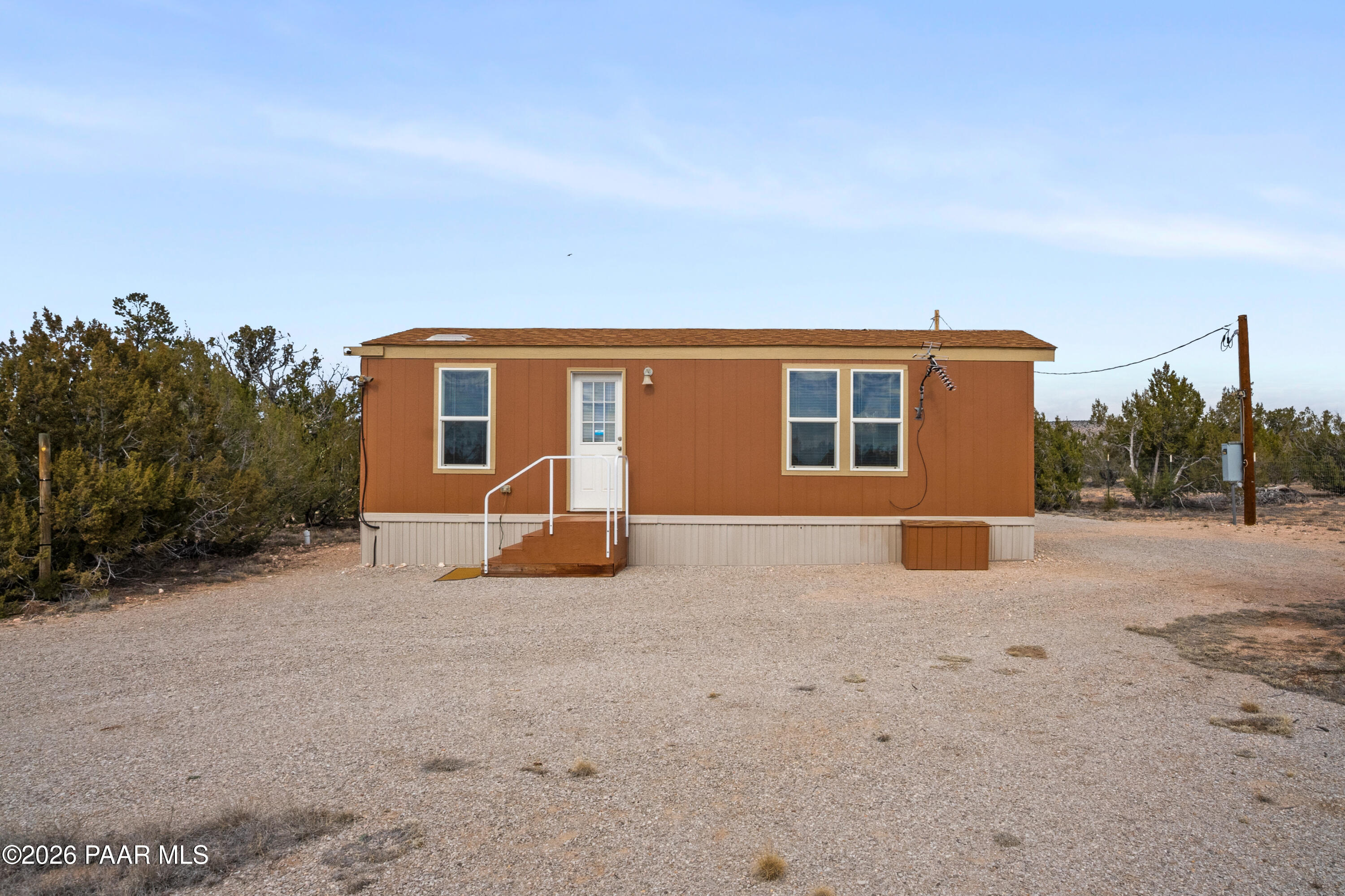 25815 Fort Rock Road Seligman, AZ 86337 - Photo 15 of 30 a backyard of a house with basket ball court and outdoor seating