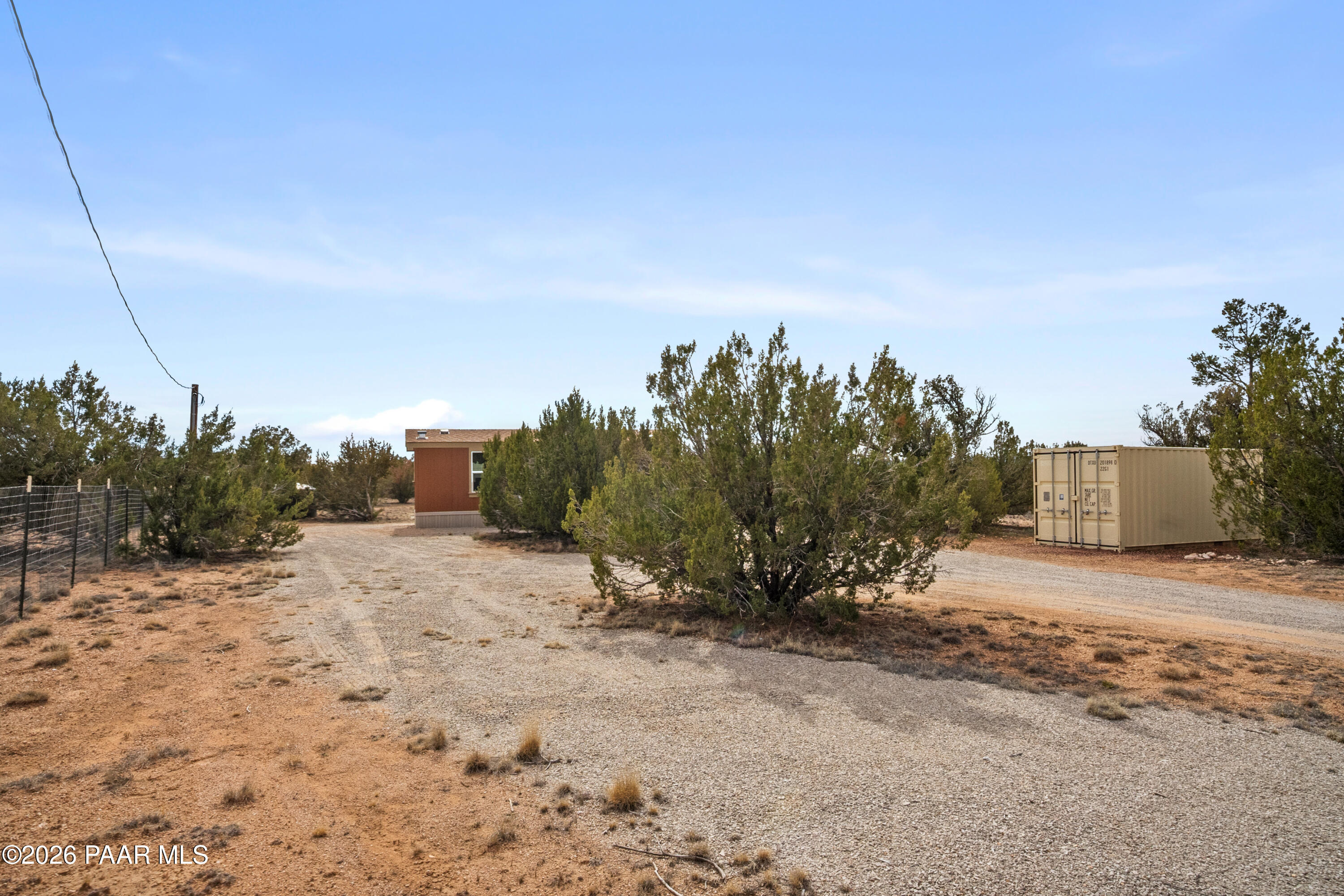 25815 Fort Rock Road Seligman, AZ 86337 - Photo 21 of 30 a view of dirt road with a building in the background