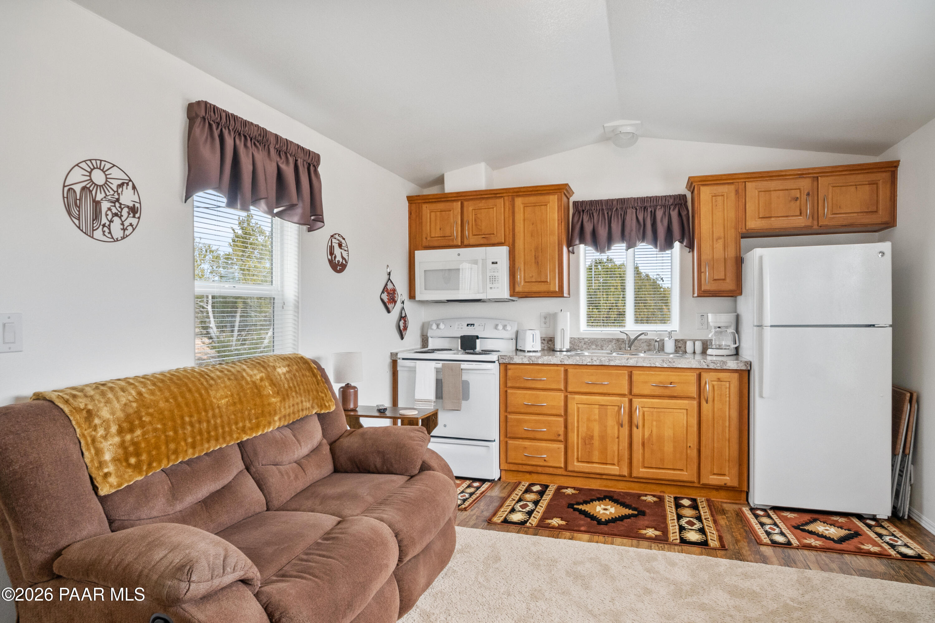 25815 Fort Rock Road Seligman, AZ 86337 - Photo 4 of 30 a living room with a couch and a window