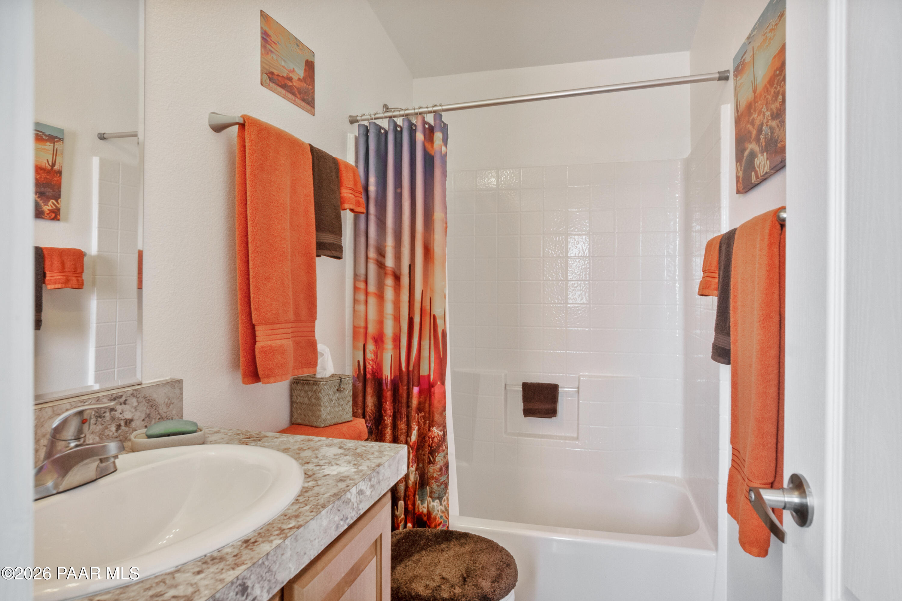 25815 Fort Rock Road Seligman, AZ 86337 - Photo 9 of 30 a bathroom with a granite countertop sink and a bathtub
