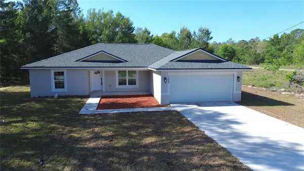 a front view of a house with yard