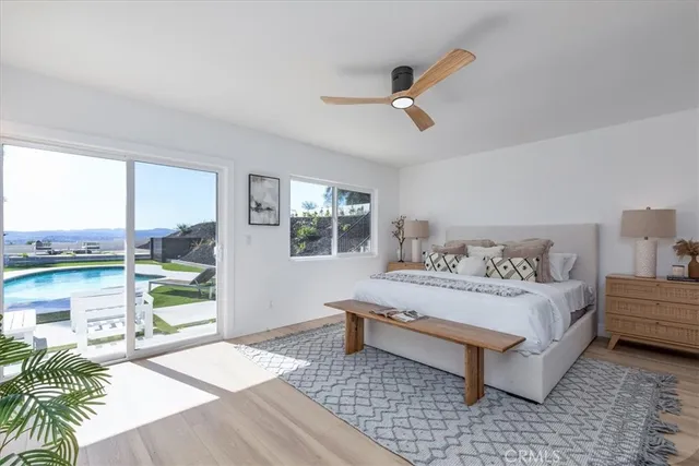 a spacious bedroom with a bed and a window