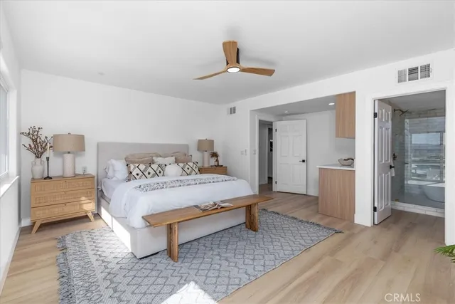 a bedroom with a bed and a view of walk in closet