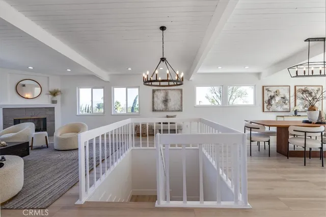 a view of a livingroom with furniture window and wooden floor