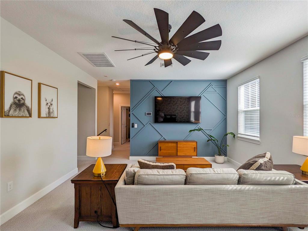 3324 Big Sky Way Lakewood Ranch, FL 34211 - Photo 19 of 49 a living room with furniture and a flat screen tv