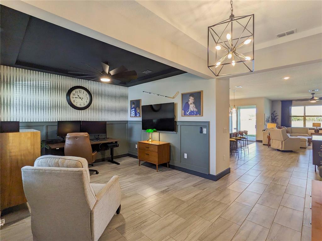 3324 Big Sky Way Lakewood Ranch, FL 34211 - Photo 2 of 49 a living room with furniture and a flat screen tv
