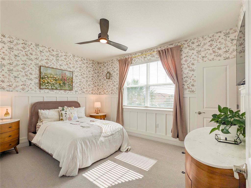 3324 Big Sky Way Lakewood Ranch, FL 34211 - Photo 24 of 49 a bedroom with a bed and a table