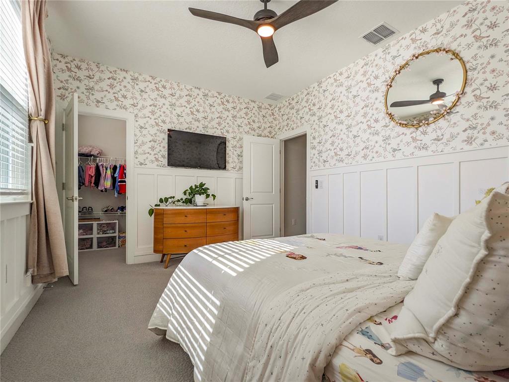 3324 Big Sky Way Lakewood Ranch, FL 34211 - Photo 25 of 49 a bedroom with a bed and a flat screen tv
