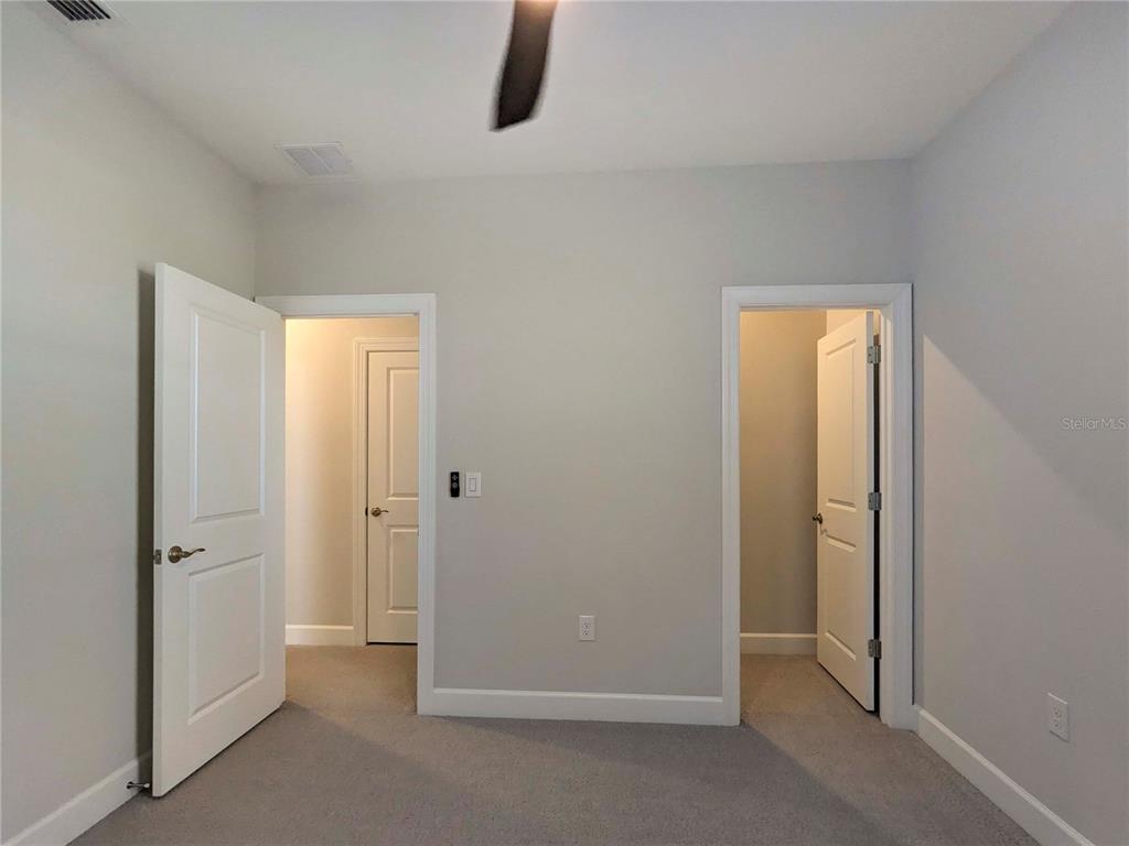 3324 Big Sky Way Lakewood Ranch, FL 34211 - Photo 29 of 49 an empty room with closet and mirror