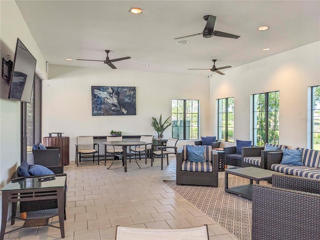 3324 Big Sky Way Lakewood Ranch, FL 34211 - Photo 43 of 49 a living room with furniture potted plant kitchen view and a window
