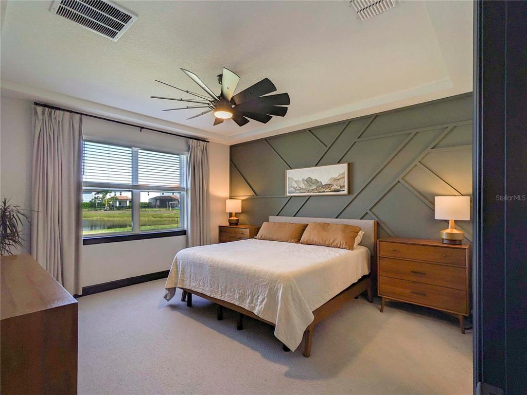 3324 Big Sky Way Lakewood Ranch, FL 34211 - Photo 10 of 49 a bedroom with a bed and a large window