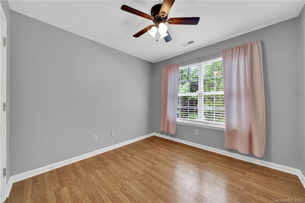 941 Copperstone Lane Fort Mill, SC 29708 - Photo 12 of 17 a view of a room with a ceiling fan and a window