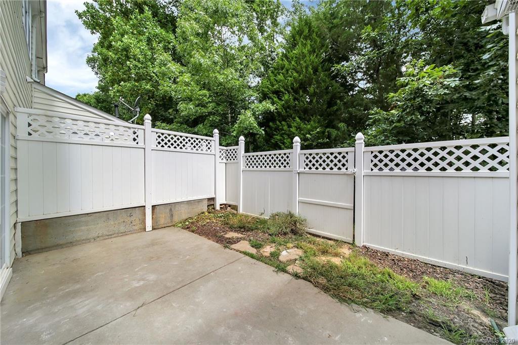 941 Copperstone Lane Fort Mill, SC 29708 - Photo 17 of 17 a backyard of a house with white floor and fence