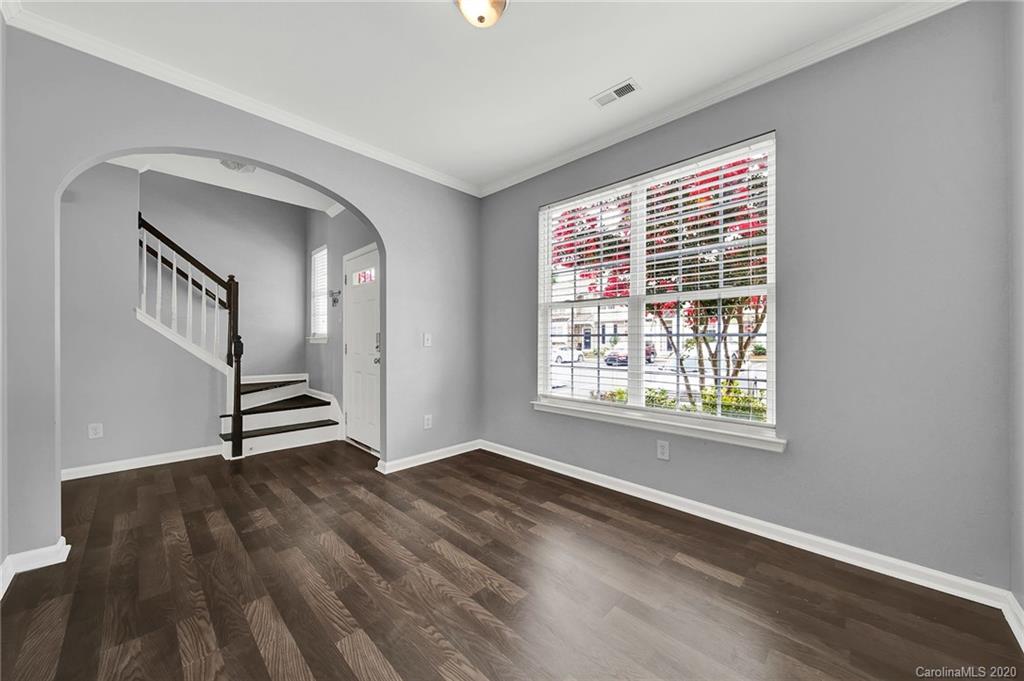 941 Copperstone Lane Fort Mill, SC 29708 - Photo 4 of 17 a view of an empty room with wooden floor and a window