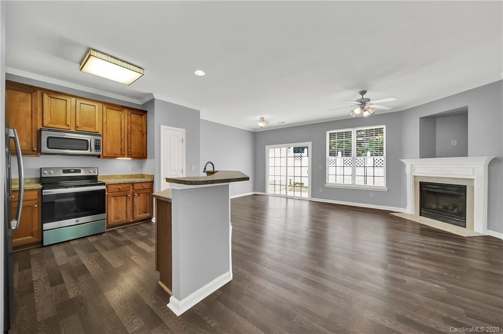 941 Copperstone Lane Fort Mill, SC 29708 - Photo 6 of 17 a kitchen with sink a microwave and cabinets