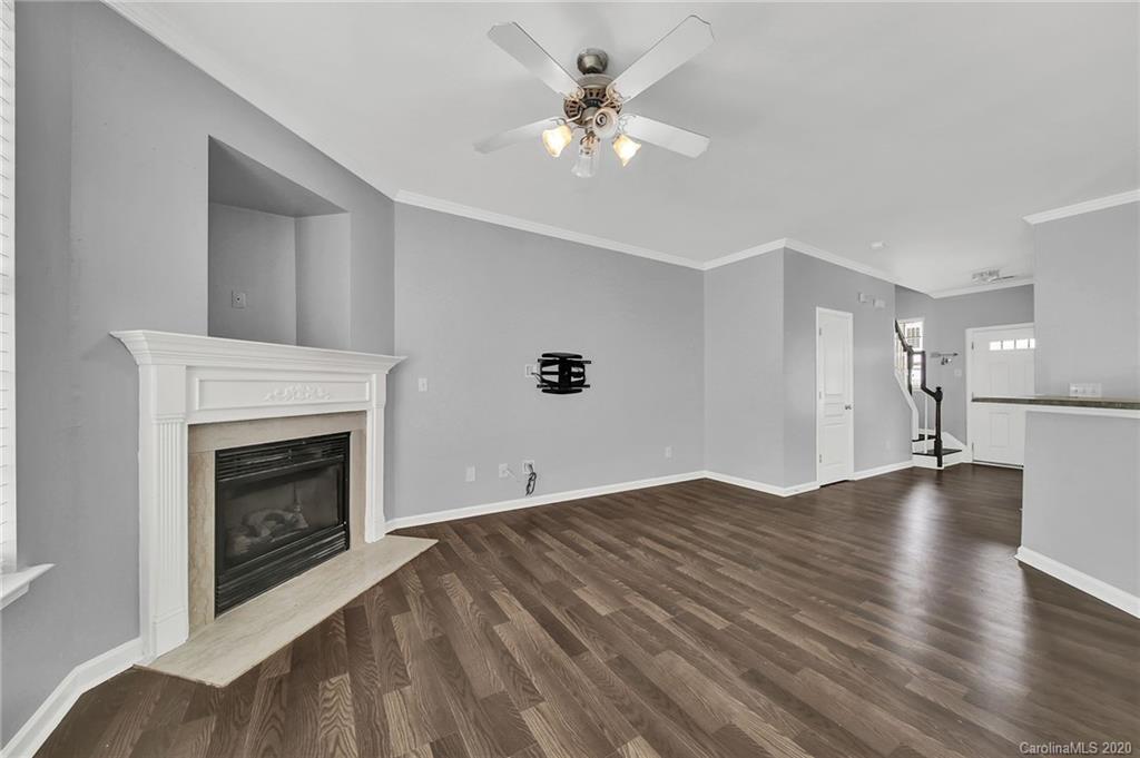 941 Copperstone Lane Fort Mill, SC 29708 - Photo 7 of 17 a view of empty room with wooden floor and fireplace