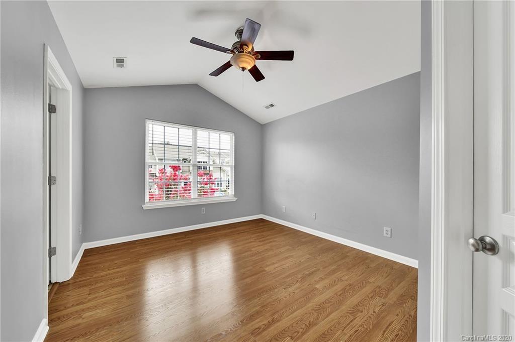 941 Copperstone Lane Fort Mill, SC 29708 - Photo 9 of 17 a view of room with window ceiling fan and hardwood floor