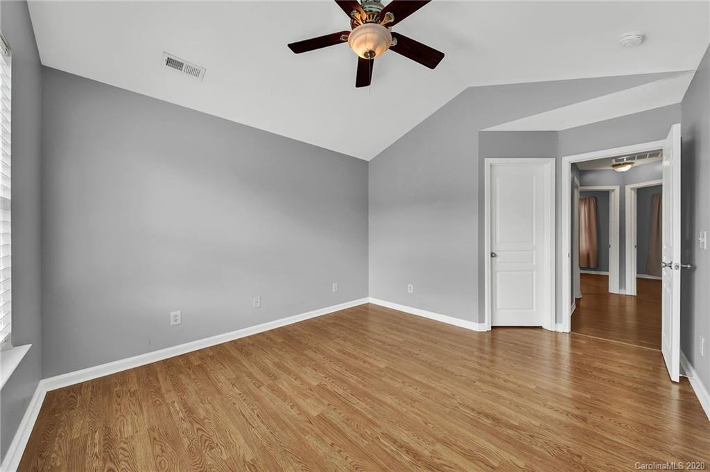941 Copperstone Lane Fort Mill, SC 29708 - Photo 10 of 17 wooden floor in an empty room with a window