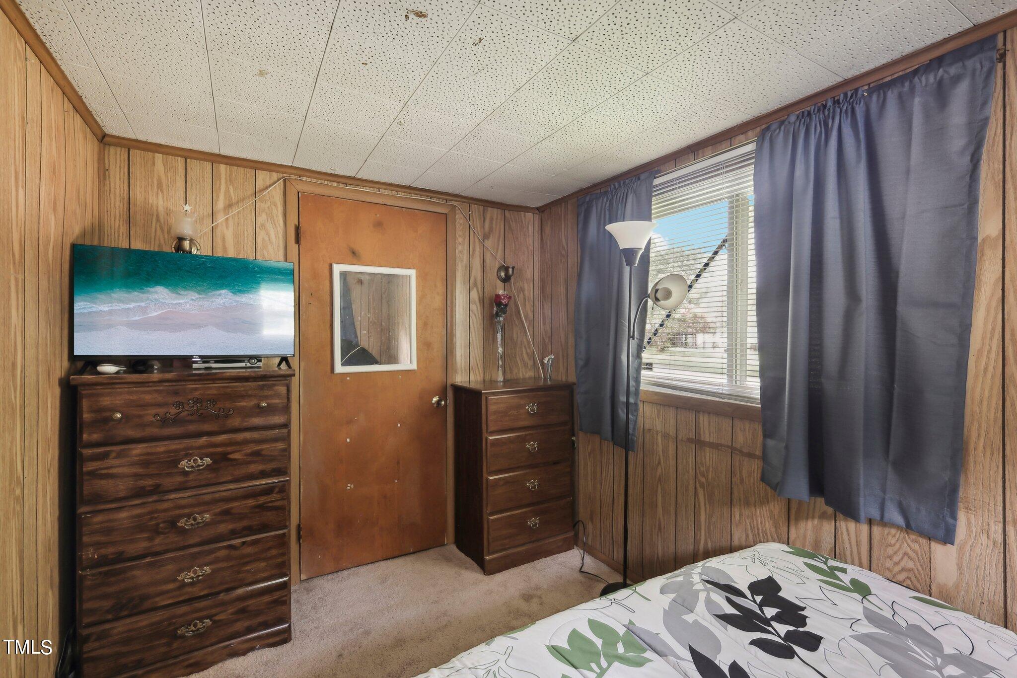 2917 State Street Durham, NC 27704 - Photo 10 of 22 a bedroom with a bed and a dresser