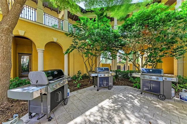 a view of a balcony with potted plants